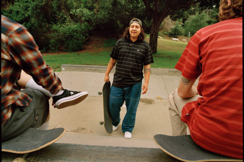 Group of skateboarders wearing Dickies jeans and shirts