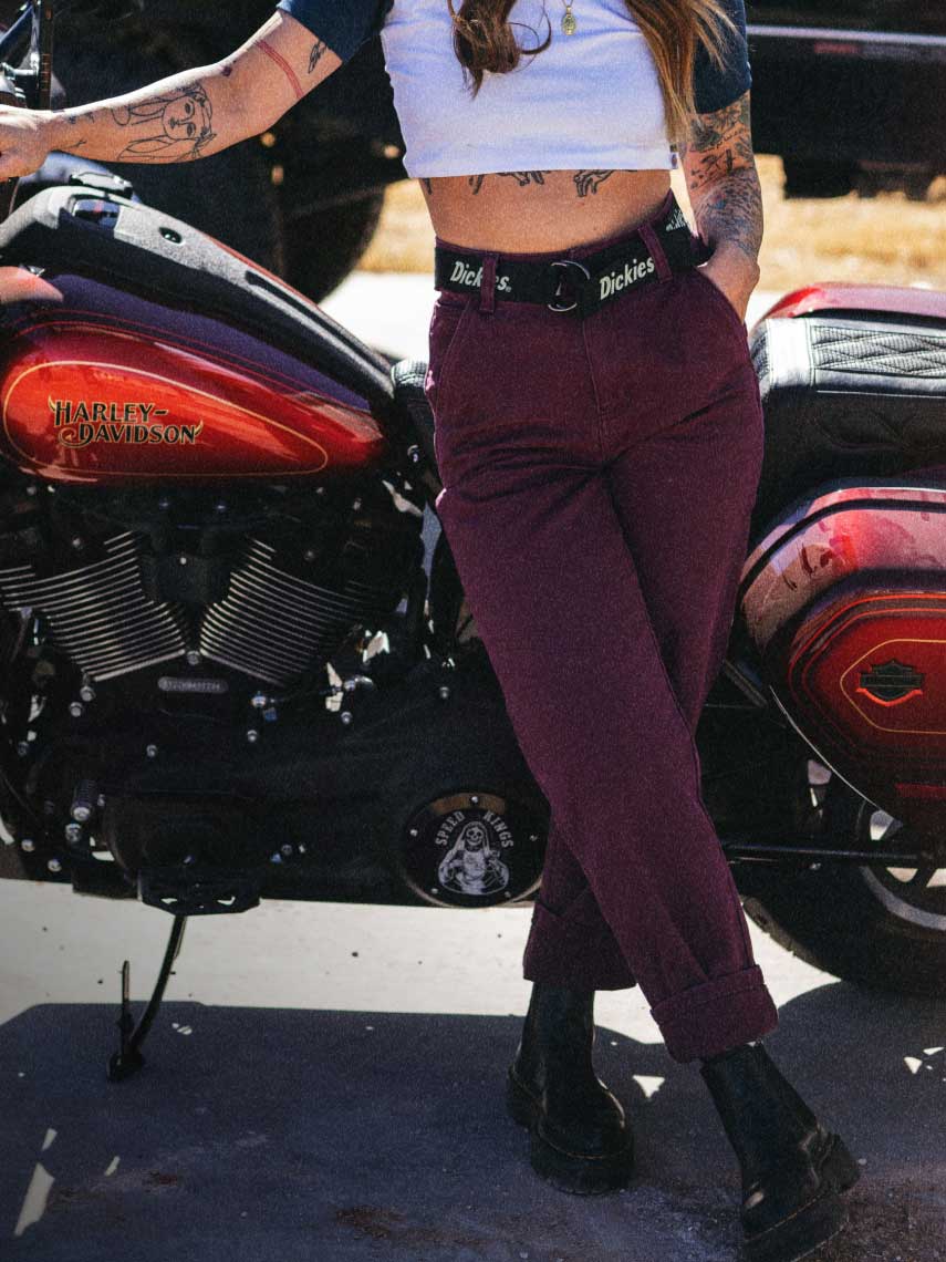 Woman wearing pants on a sunny day. 