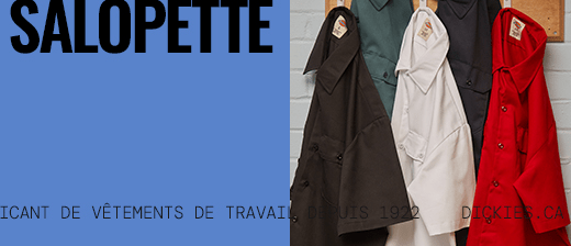several dickies work shirts hanging on a wall