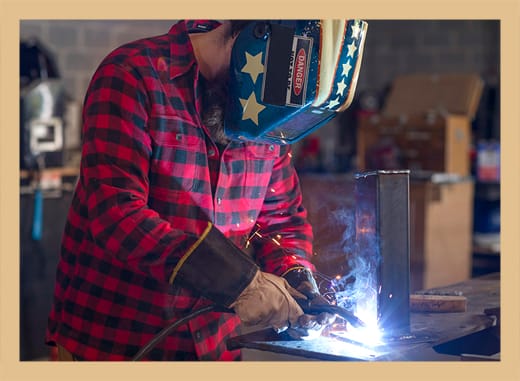 Dominic refining his welding skills.