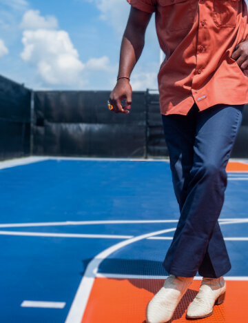 a man wearing dickies 874 work pants on a basketball court