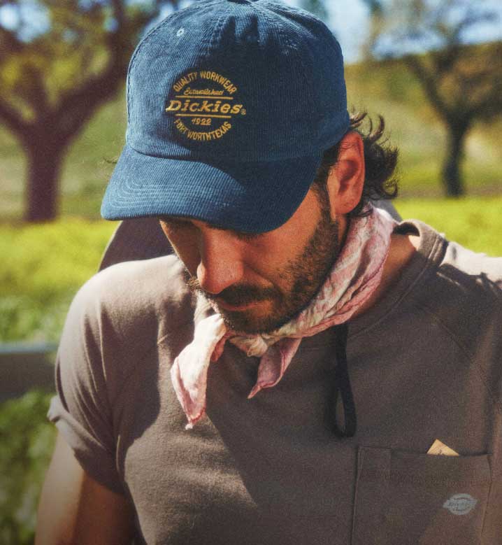 A closeup of a man wearing a hat.