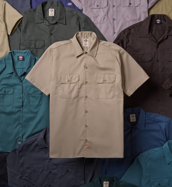 A front view of Dickies 1574 khaki work shirt with multi-colored work shirts behind.