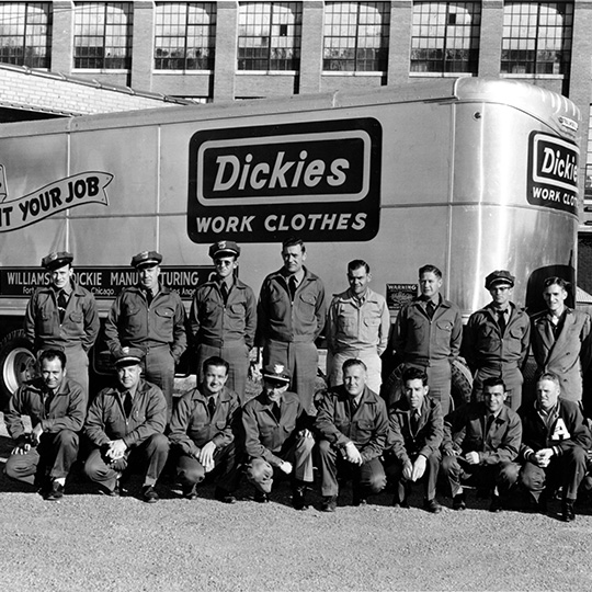 A group of men lined up for a group photo.